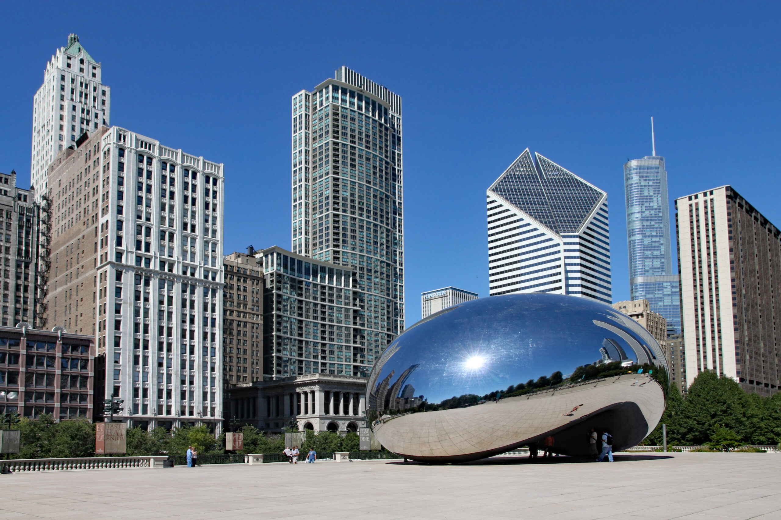 Chicago's Cloud Gate sculpture in Millennium Park with skyline behind, home to Moore Colson's Chicago business valuation clients.