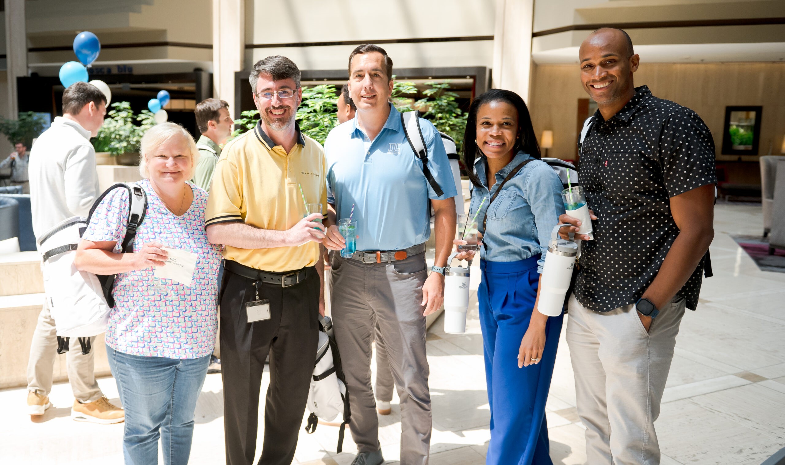 Moore Colson team members smiling together at a firm event, reflecting the culture built by independence.